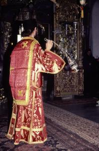 Deacon censing the altar during Pentecost service