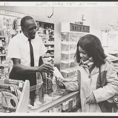 A pharmacist assists a customer