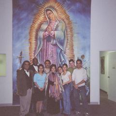 MEChA members in front of religious image