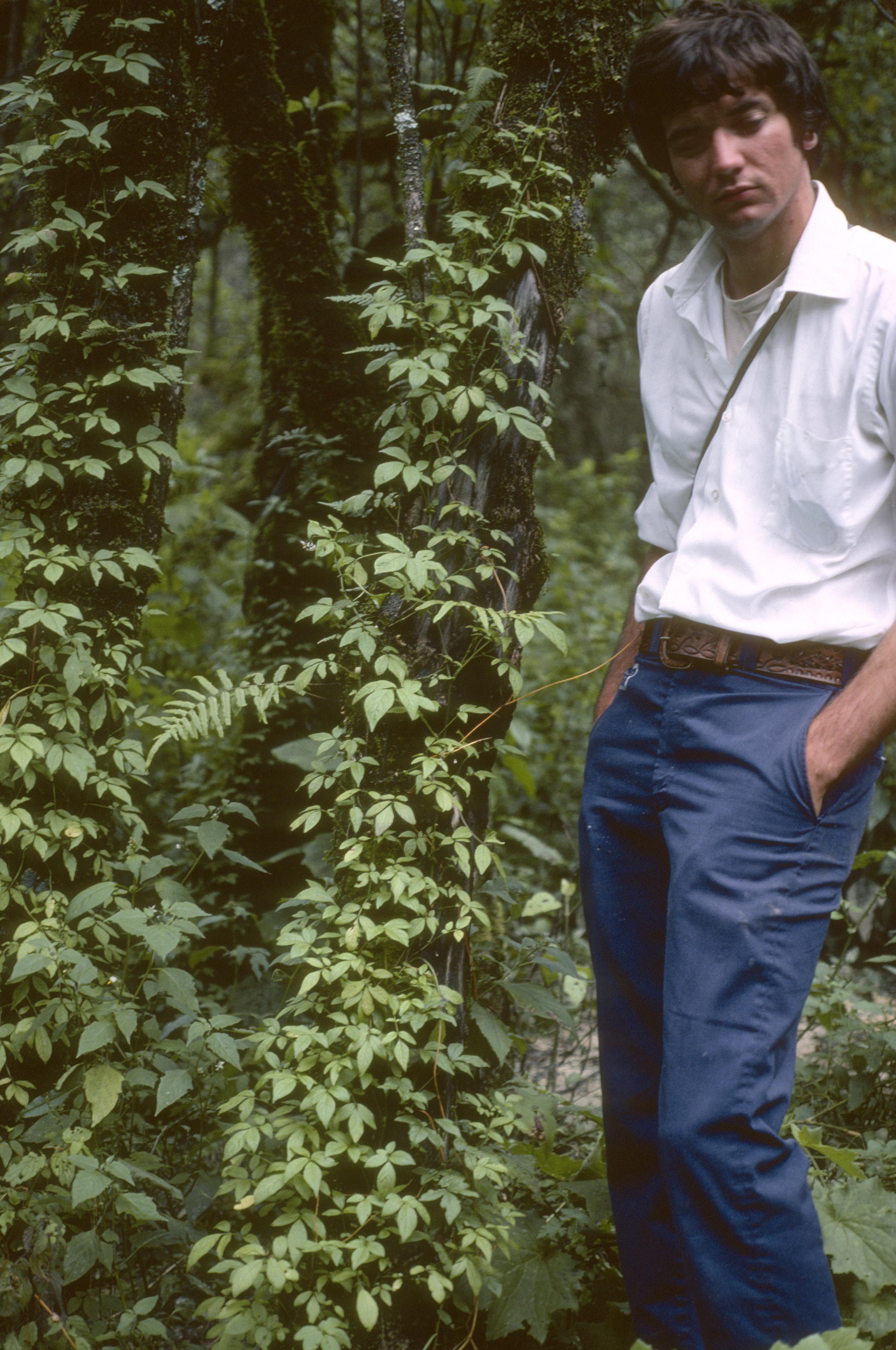 Man Climbing Palm Tree with Aid of Rope Made From Palm - UWDC - UW-Madison  Libraries