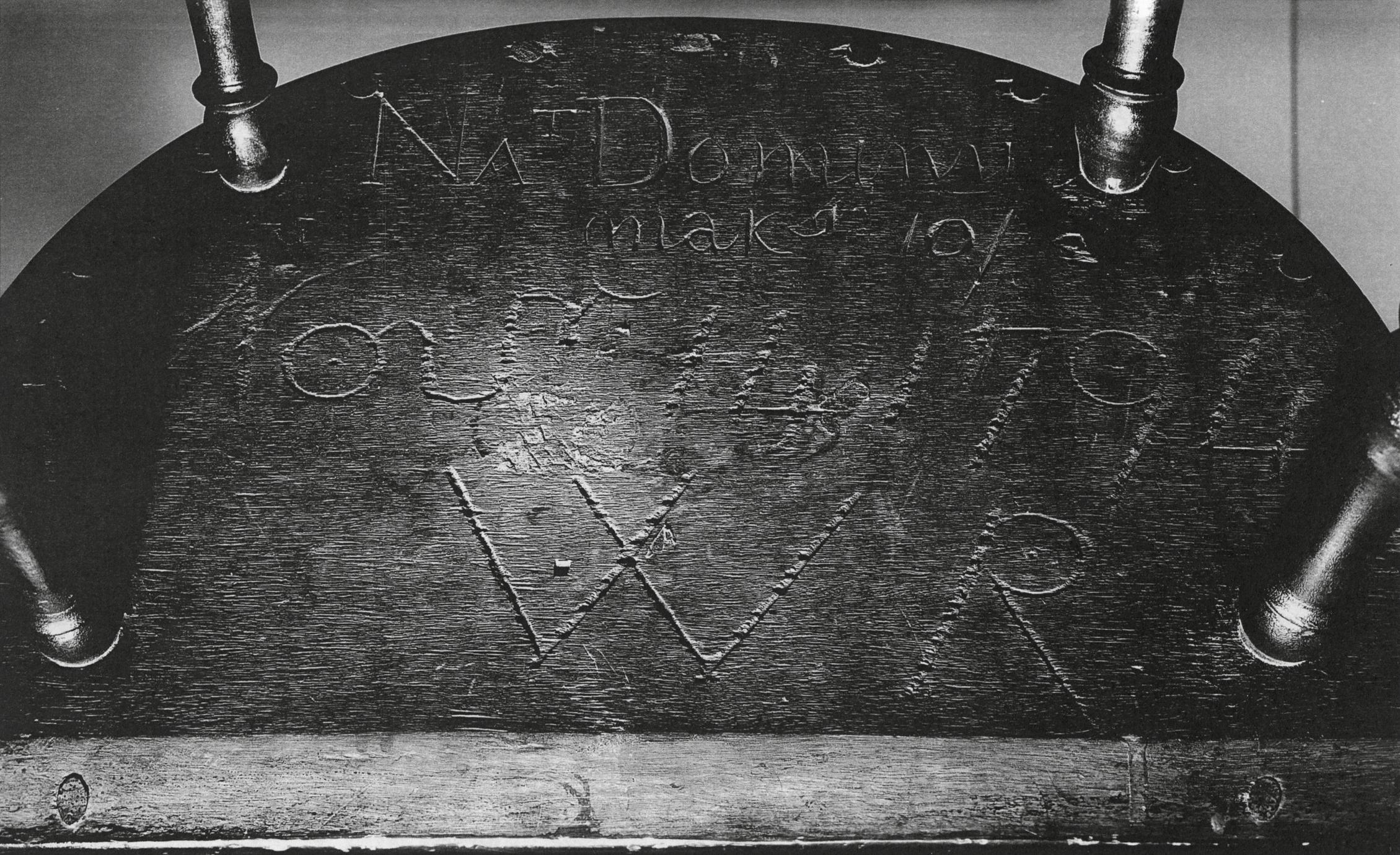 Black and white photograph of Dominy's stamp on the underside of the Windsor armchair.