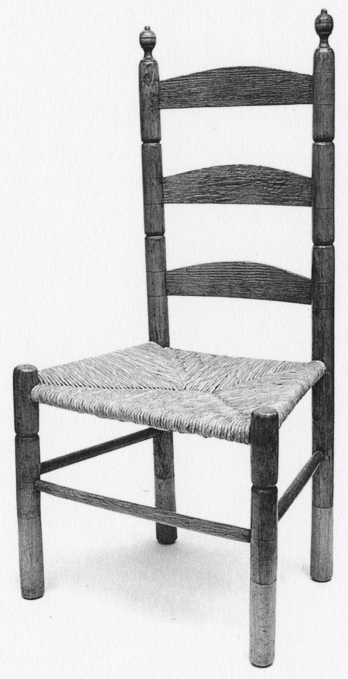 Black and white photograph of a slat-back chair.