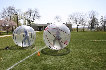 Students have fun in giant hamster balls