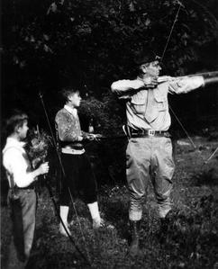 Aldo Leopold and others with bows and arrows