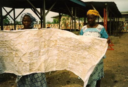 Women holding fabric