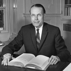 Conrad A. Elvehjem with a book