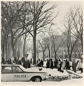 Vietnam War protest with police car