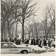 Vietnam War protest with police car