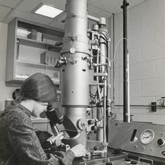 Woman at electron microscope