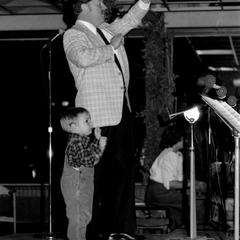 Ray Wifler and toddler conducting band, UW Fond du Lac
