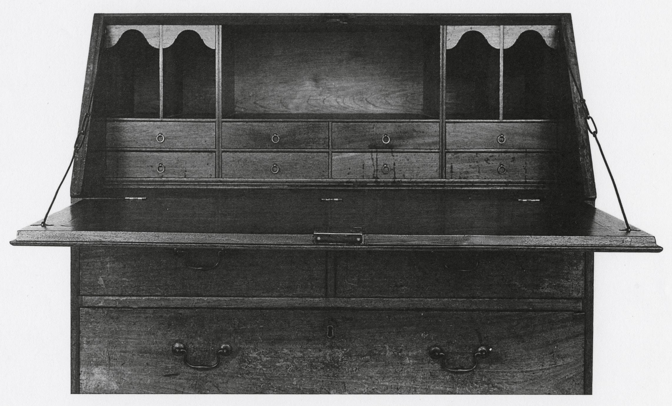 Black and white photograph of a desk.