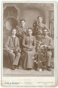 Brass quartet and woman with a book