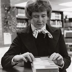 Librarian Mary Howard using card catalog