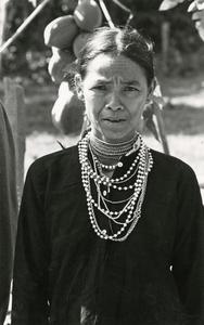 Nyaheun woman displays her traditional Nyaheun necklace in Attapu Province