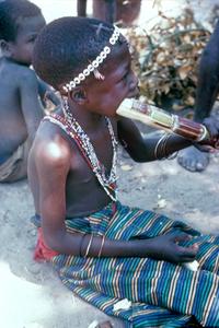 Boy Eating Sugar Cane While on Break from Mbondo Initiation Ceremony