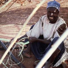 Man Making Rope from Palm Tree Fiber