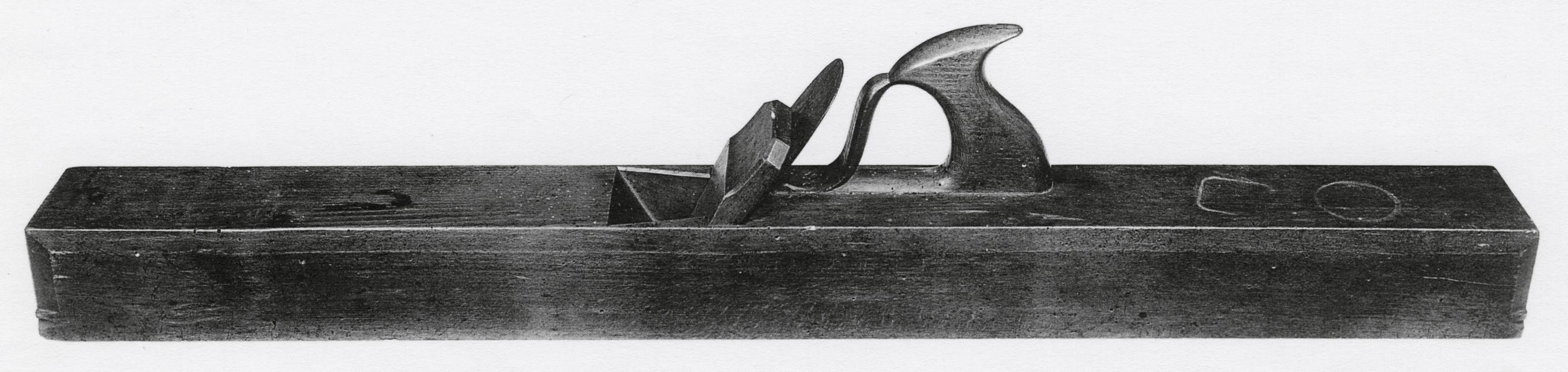 Black and white photograph of a jointer plane.