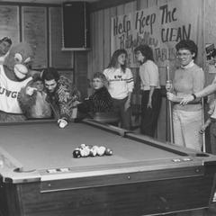Students with Phoenix mascot playing pool in the student union's Rathskeller