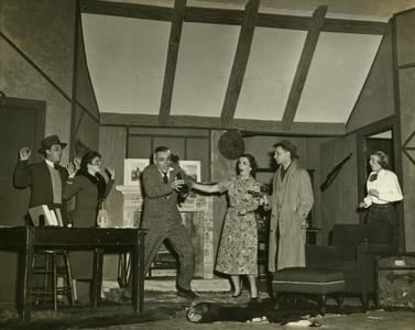 Alpha Psi Omega - Performing a play onstage, living room hostage scene