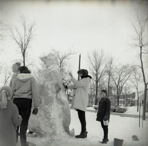 Students building a snow sculpture during Snow Week