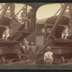 Theodore Roosevelt atop a steam shovel in Panama