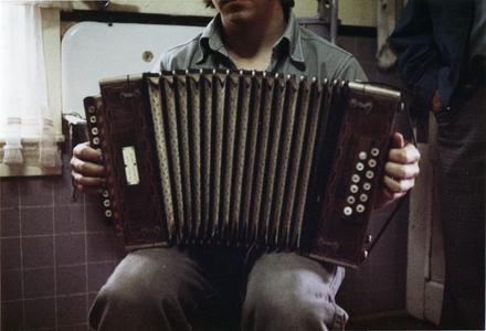 Matthew Gallmann holds Matti Pelto's button accordion