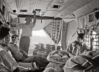 Crew and passengers on an Air America Caribou flight