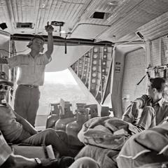 Crew and passengers on an Air America Caribou flight