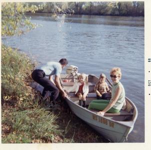 Schoessow family in rowboat