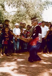 Hmong man playing Hmong "qeej" for Hmong New Year in Houa Khong Province
