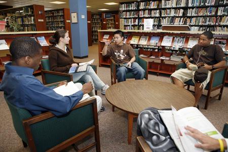 Students have conversation in the library