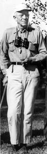 Aldo Leopold with cane and binoculars