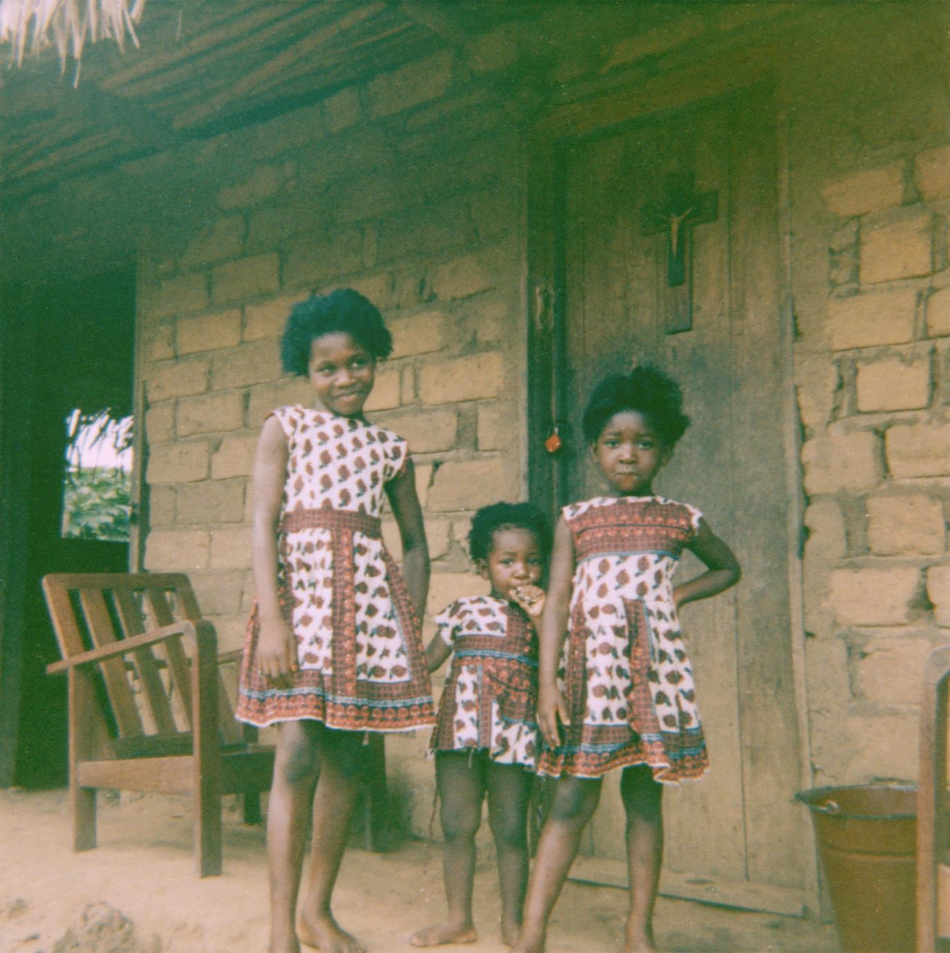Girls in Front of House in Selenge Fishing Village with Modern-Style House,  Furniture, and Clothing - UWDC - UW-Madison Libraries