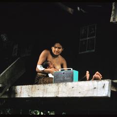Ban Pha Khao : woman nursing with transistor radio