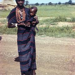 A Fulbe Woman with Her Child in Traditional Best Dress