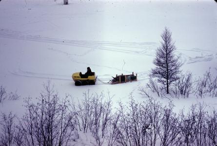 Towing gear sled across the ice