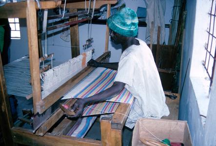 Man Weaving at Loom