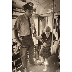 Bus driver offers his hand to an elderly passenger boarding the bus in Milwaukee, Wisconsin