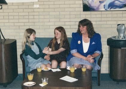 Woman and two girls at 1995 graduation reception