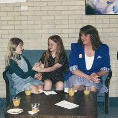 Woman and two girls at 1995 graduation reception