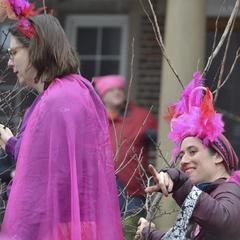 Two people in pink feather hats