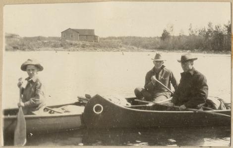 Canoeing in Quetico, cabin in background, June 1924