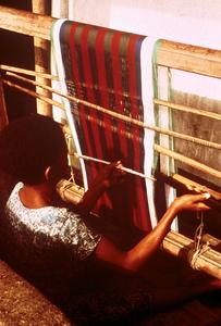 Young Igbo Weaver Working on a Horizontal Loom
