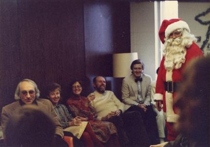 Faculty members at a Christmas party