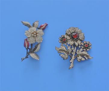 Two flower brooches