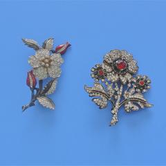 Two flower brooches