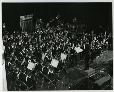 Stout State University band performing on stage, Lynn Pritchard conductor