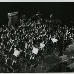 Stout State University band performing on stage, Lynn Pritchard conductor
