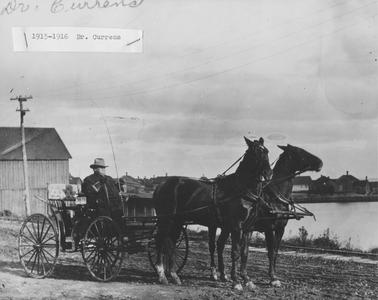 Dr. Currens in his horse pulled buggy.