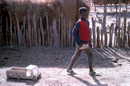 Boy Pulling Hand-Made Wagon